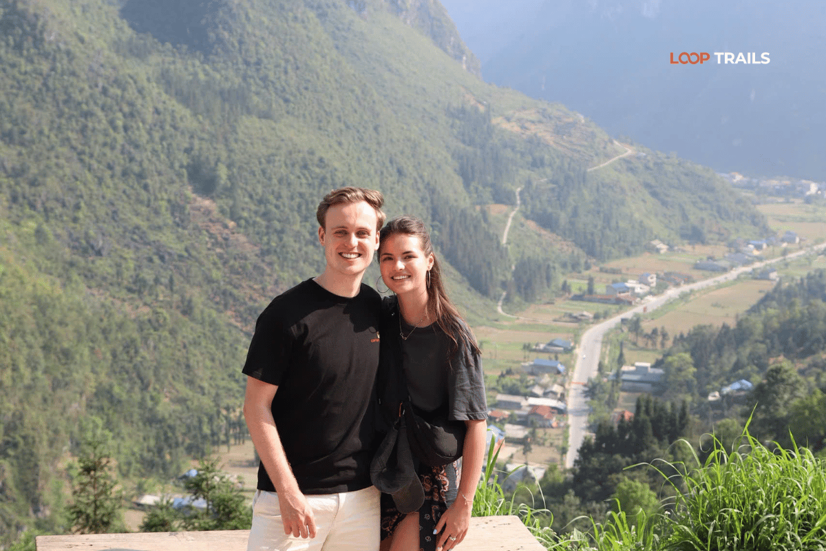 Traveller standing on Ma Pi Leng Pass after a private Ha Giang jeep tour with Ha Giang by Jeep