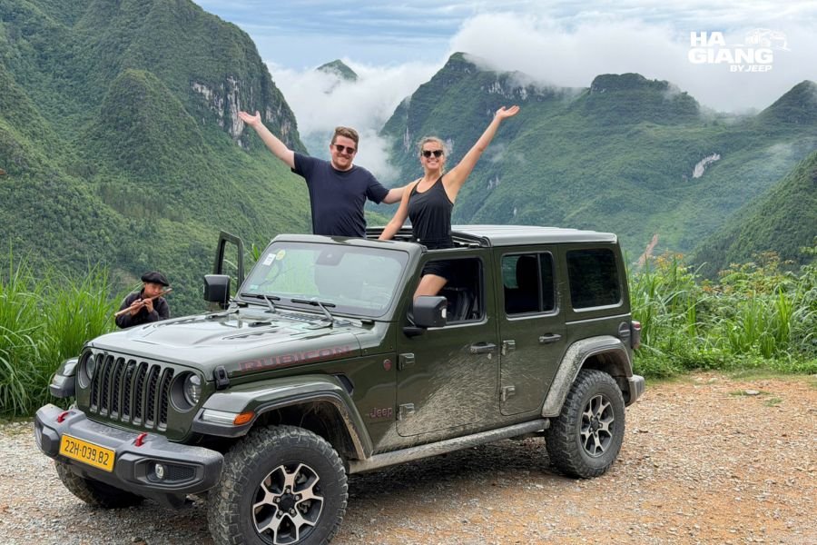 Open-air jeep tour showing Ha Giang mountains and valley views