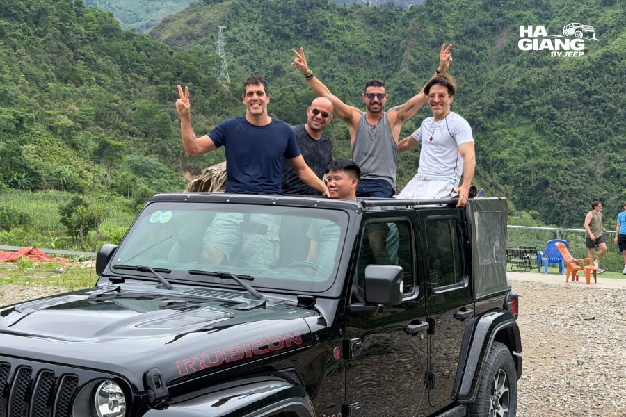 Parked Wrangler Rubicon jeep at mountain overlook with scenic mountain vistas and valley views showing self-drive tour flexibility