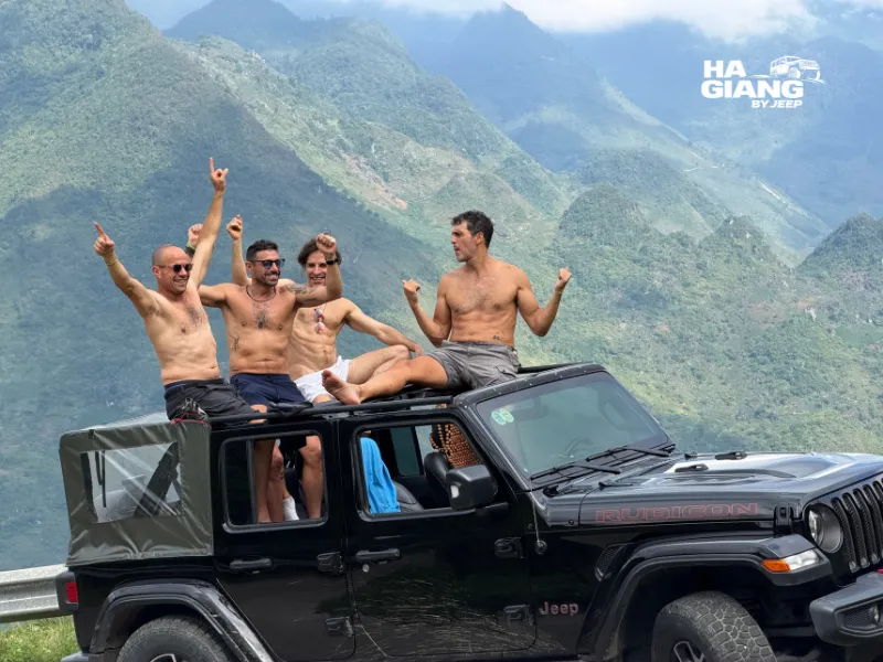 Ha Giang Loop jeep tour driving through limestone mountains in northern Vietnam