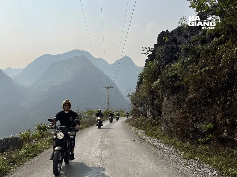 Self drive motorbike on a winding Ha Giang Loop mountain road