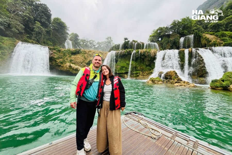 Ban Gioc Waterfall in full flow with the Quay Son River and karst peaks behind