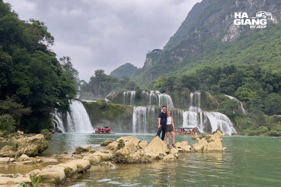 Ban Gioc Waterfall three-tier cascade through limestone canyon, Ha Giang