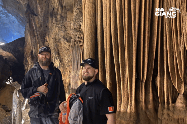 Close detail of flowstone and stalactite formations lit inside Lung Khuy Cave, Quan Ba, Ha Giang