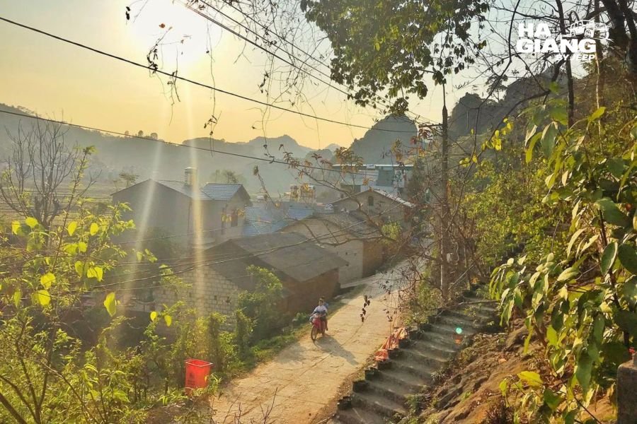 Cold sunrise over Dong Van Old Quarter with smoke from morning kitchens, Ha Giang
