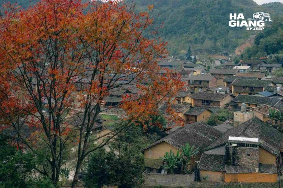 Foggy stone lane between earth walled houses in Lo Lo Chai Village