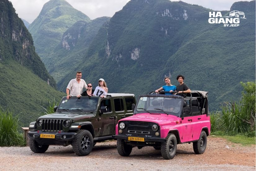 Guests and their English speaking local driver beside a private jeep in Ha Giang