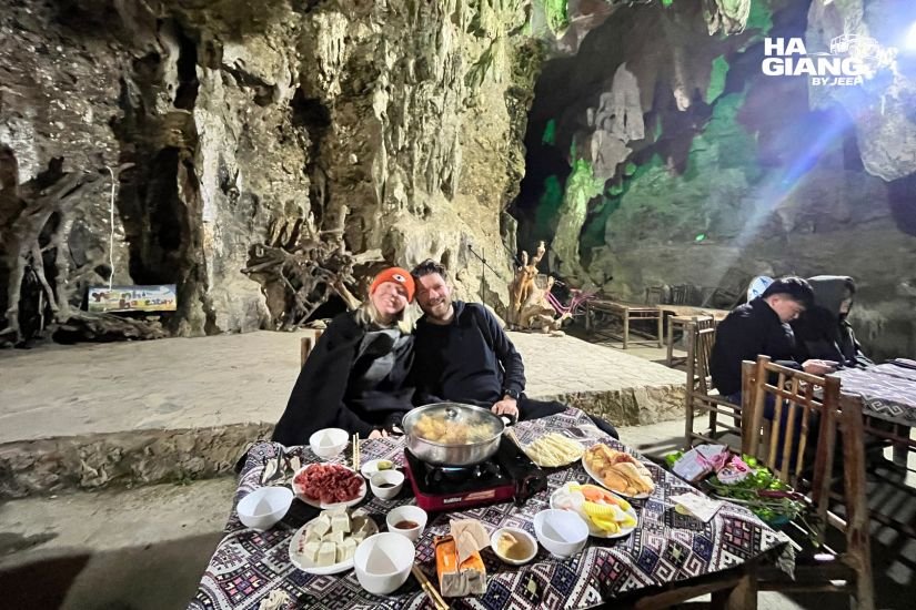 Homestay dinner in the mountains with local dishes and a bottle of corn wine
