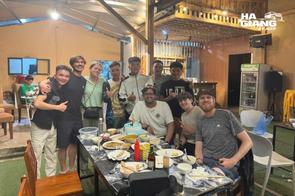 Shared homestay dinner and corn wine on a Ha Giang jeep tour