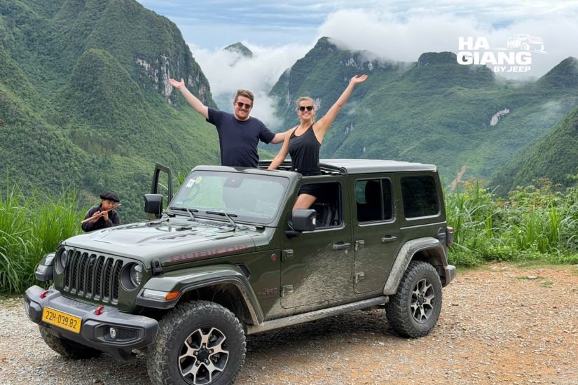 Jeep driving the switchback road of Ma Pi Leng Pass above the Nho Que gorge