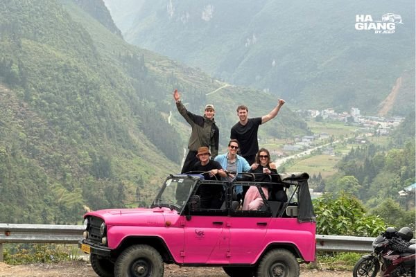 Jeep with soft top up driving safely through Ha Giang rain