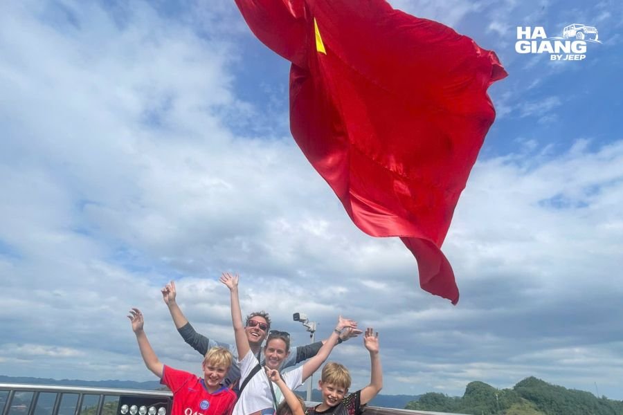 Large national flag flying above the Lung Cu Flag Tower