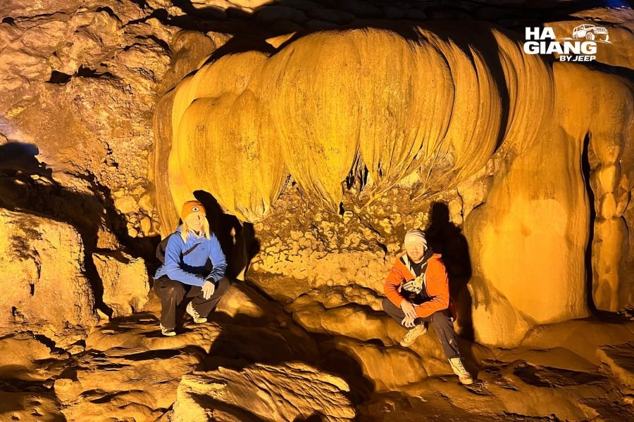 Lit stalactite formations inside Nguom Ngao Cave near Ban Gioc Waterfall