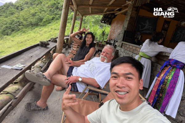 Local English speaking driver and guests at a viewpoint over the Quan Ba valley in Ha Giang