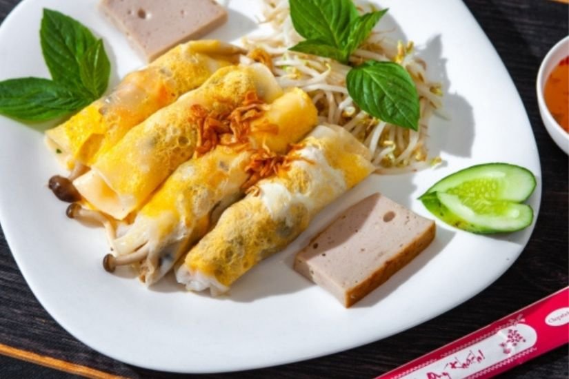Local Ha Giang breakfast of banh cuon trung served with warm broth