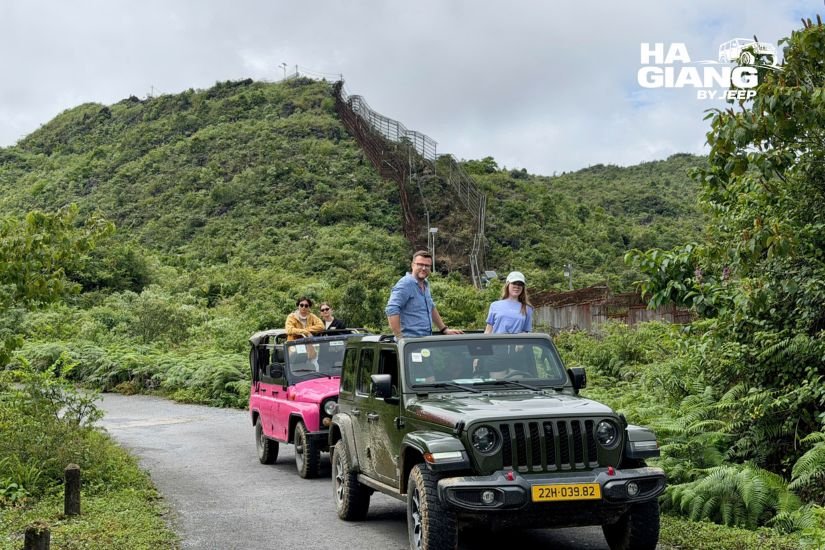 Open air jeep on a mountain road at sunset in Ha Giang