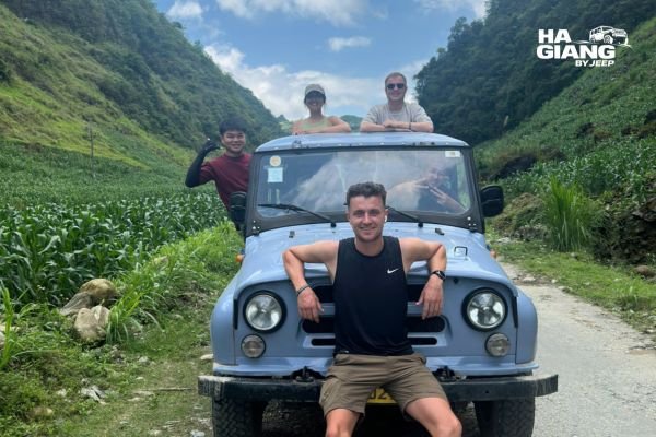 Open air jeep with soft top on a misty Ha Giang mountain road
