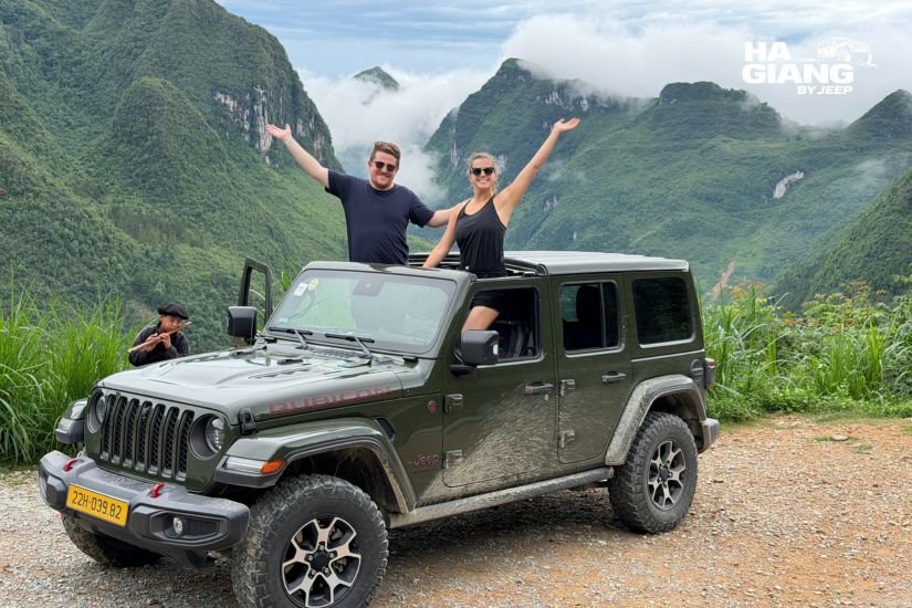 Private jeep on a winding mountain road through Yen Minh pine forest