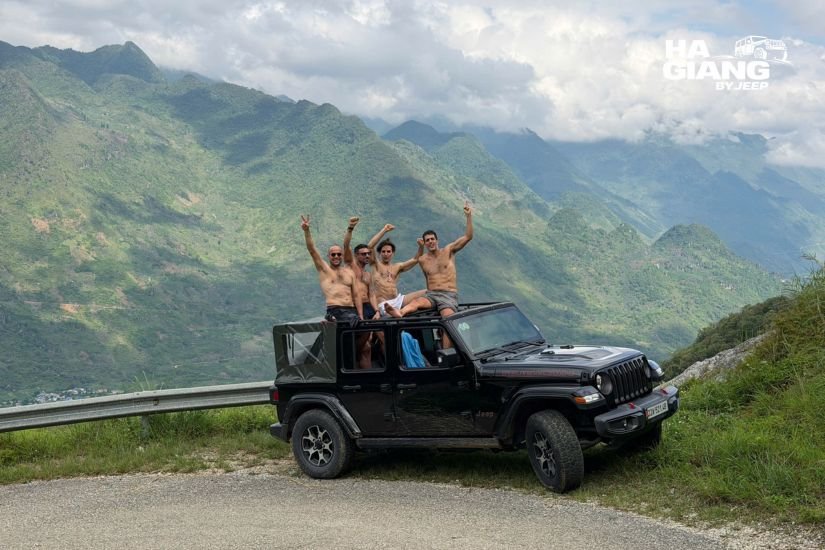 Private jeep on the Ha Giang Cao Bang 5 day itinerary parked above the Nho Que River at Ma Pi Leng Pass