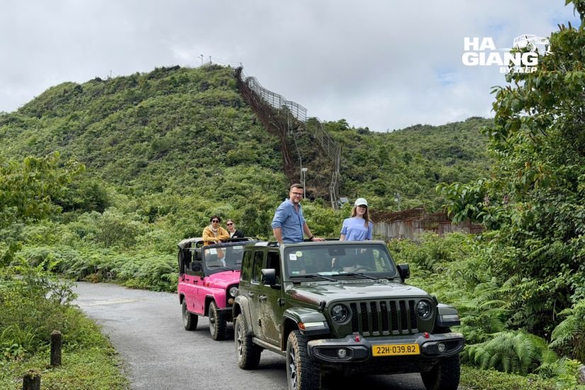 Soft top jeep keeping guests warm and dry on a rainy Ha Giang Loop day