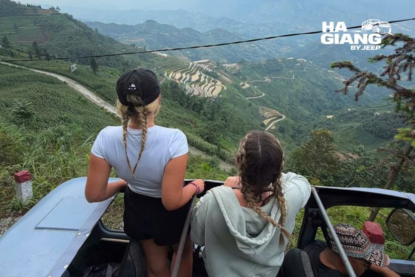 Terraced valley and karst peaks seen from an open air jeep in Ha Giang