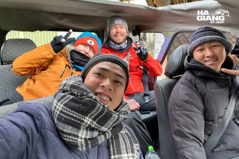 Travelers in warm layers in a private jeep on the Ha Giang Loop in October