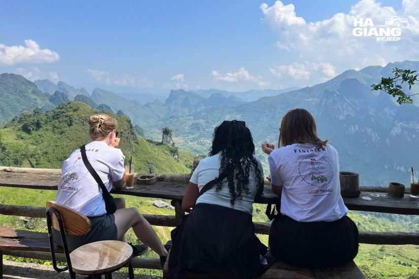 Travelers stopping at Ma Pi Leng Pass during a private jeep tour of Ha Giang