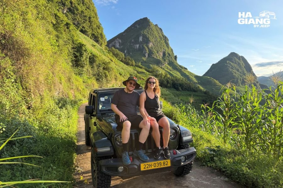 Jeep on Ma Pi Leng Pass with storm clouds breaking apart, visiting Ha Giang in September