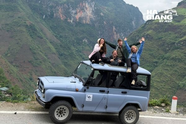 Why choose a jeep for the Ha Giang Loop: open air jeep parked above the Nho Que River at Ma Pi Leng