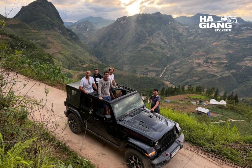 Ha Giang jeep tour what to expect: a private open air jeep parked at Ma Pi Leng Pass above the Nho Que River