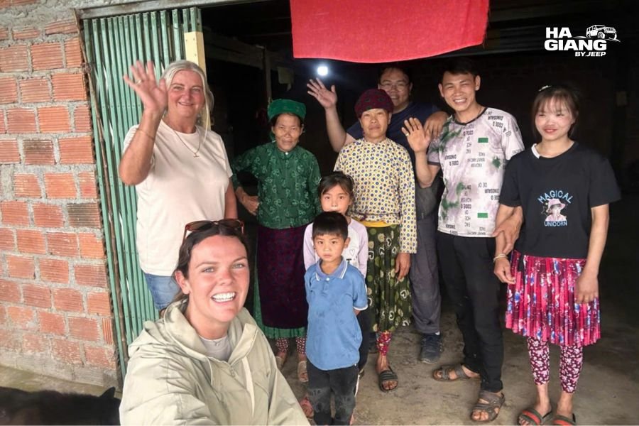 A local driver stopping to talk with a resident on a Ha Giang mountain road