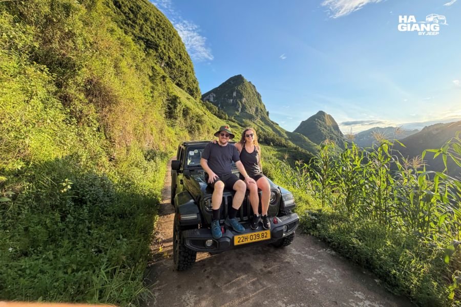 An older traveler in the front passenger seat of a jeep in Ha Giang