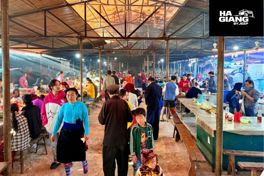 Dong Van Sunday Market with local vendors selling goods and travelers exploring