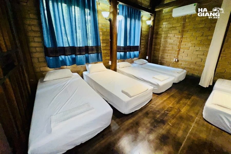Dorm platform with mattresses and mosquito nets in a Ha Giang homestay