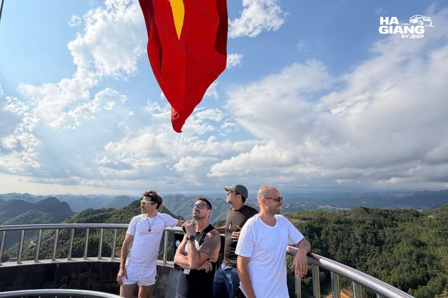 Group on the steps at Lung Cu Flag Tower in Ha Giang