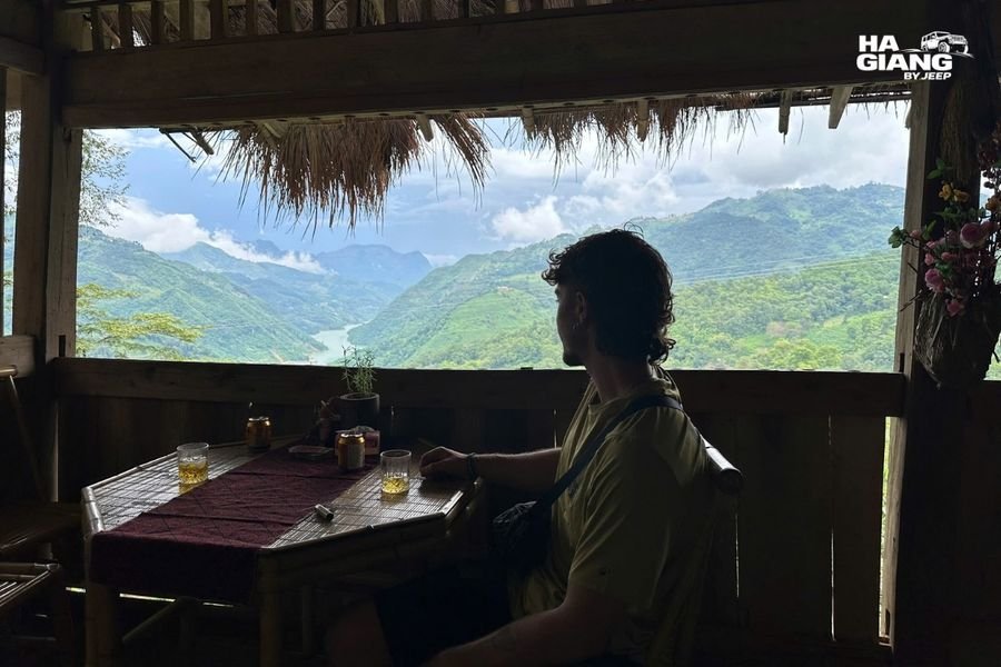 Ha Giang homestay at dusk with light coming from the doorway