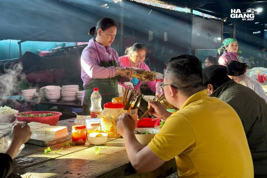 Hmong women at a textile stall in a Ha Giang ethnic market