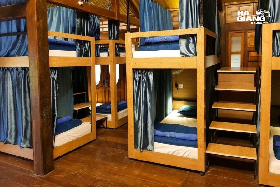 Homestay dorm platform with mattresses and mosquito nets on the Ha Giang Loop
