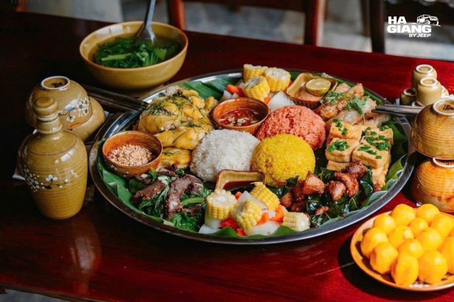 Host family cooking traditional meal with guests, warm candid interaction
