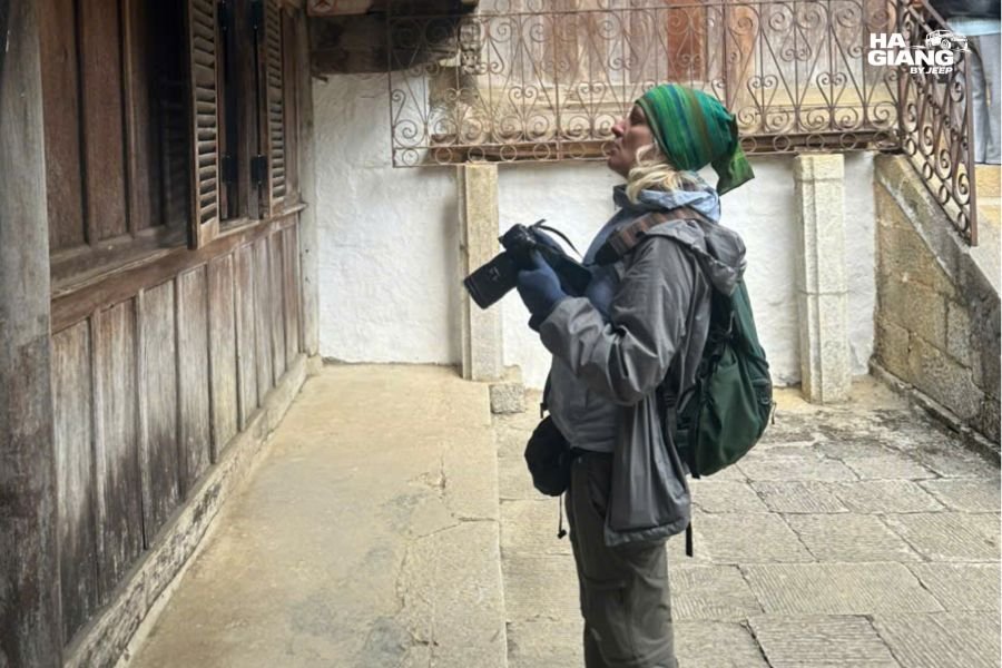 Local female guides or homestay owners with solo female visitor, connection moment
