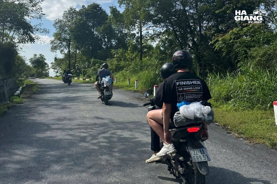 Motorbike rider on mountain road in Ha Giang Loop