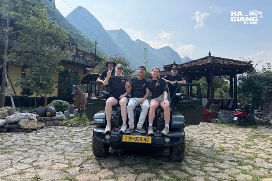 Northern Vietnam Loop: a jeep on a long mountain road running into the distance