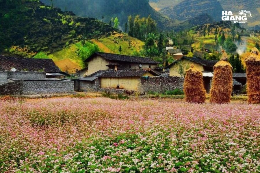 Rammed earth Hmong house with a tile roof and stone wall in Sung La