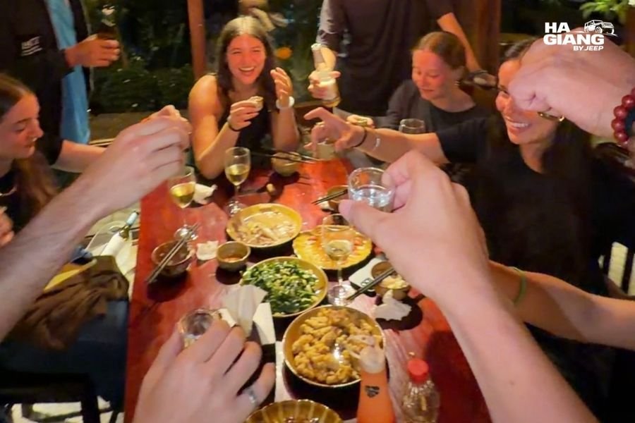 Ruou ngo corn wine poured at a Ha Giang homestay dinner