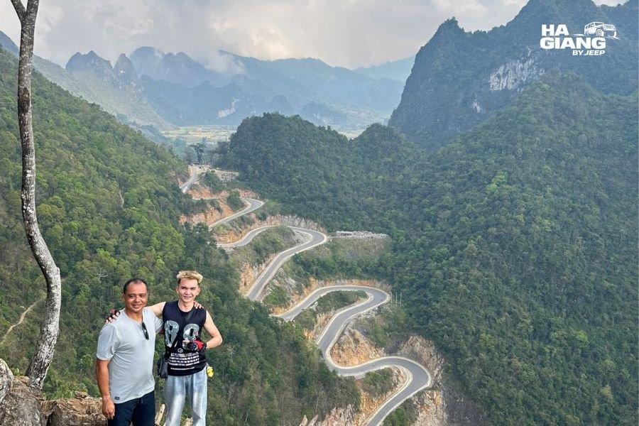Sunset lighting illuminating Khau Coc Cha Pass curves and valley landscape below