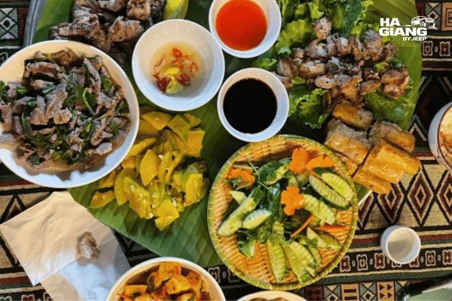 Travelers enjoying authentic local food at a roadside food stall during their journey to Ha Giang