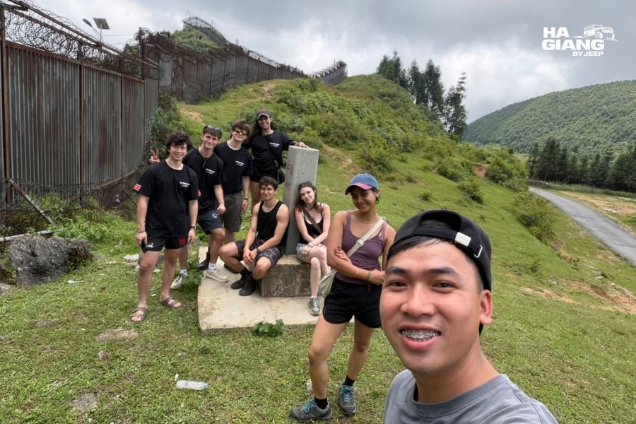 Smiling English-speaking local driver from Ha Giang with Jeep, building trust and providing insider knowledge for jeep tours