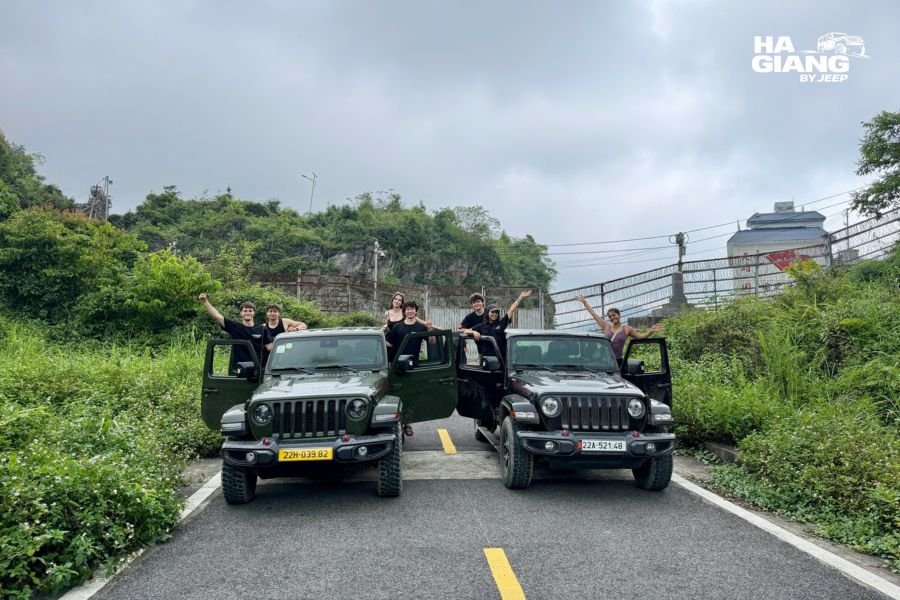Private Jeep Wrangler parked ready for journey from Hanoi to Ha Giang, showing comfortable soft-top vehicle for premium transportation