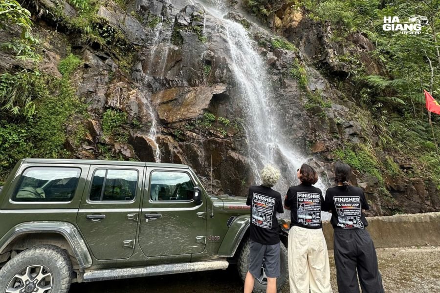 A jeep with the soft top closed in wet weather in Ha Giang