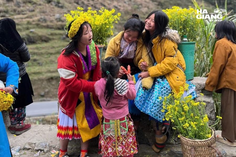 Children walking home along a road in the Ha Giang mountains